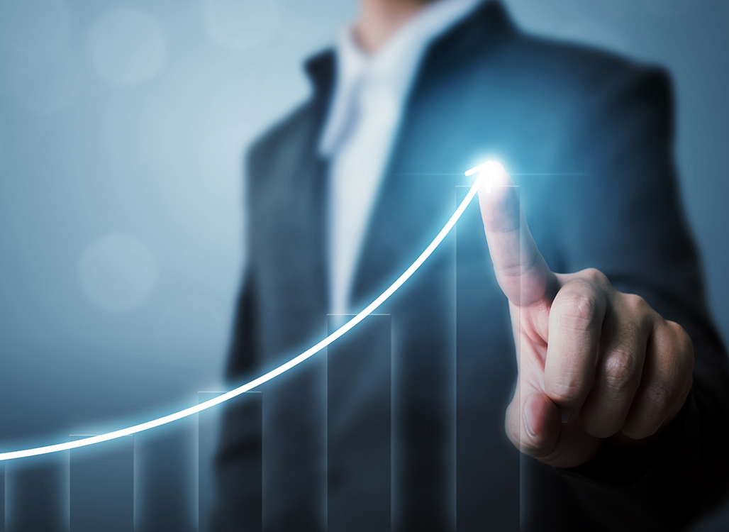 Person Pointing at Financial Chart